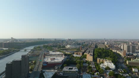 Aerial-view-over-the-south-Bronx,-approaching-the-Yankee-stadium,-summer-day-in-New-York,-USA