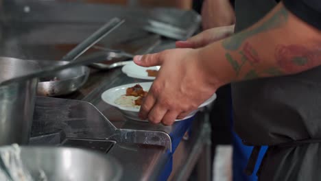 Mexican-chef-preparing-cheese-with-chorizo-longaniza-sausage-recipe-at-mexico-grill-restaurant-latin-hot-melt