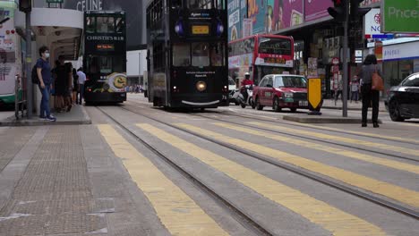 Low-angle-of-people-crossing-the-road-in-Hong-Kong