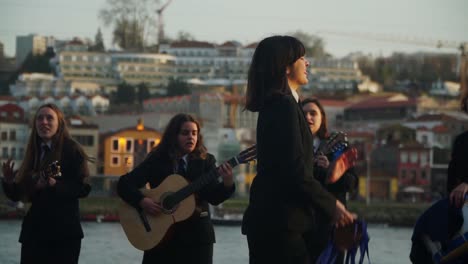 Medium-Shot,-Women-Dancing-with-her-tambourine,-Group-of-Young-women-Playing-their-instruments-and-Singing-in-the-Background