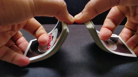 Close-up-slomo-shot-of-male-hands-shuffling-playing-cards