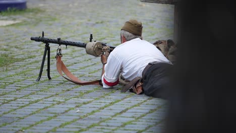 Middle-aged-man-shooting-with-machine-gun