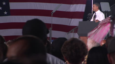 Pull-focus-from-crowd-to-President-Obama-as-he-addresses-Democratic-supporters-at-a-Moving-America-Forward-rally-at-Orr-Middle-School