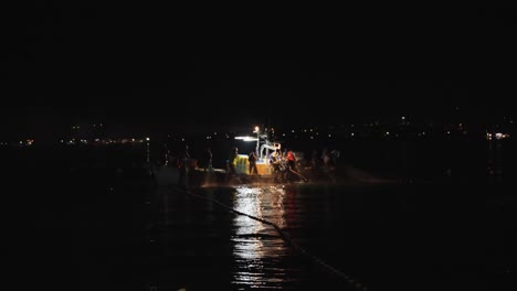 Japanese-Fishing-Boats-at-Night,-Using-Nets-to-Pull-in-Catch-in-Toyama-Bay