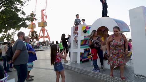 People-posing-for-photos-at-Praca-Maua,-in-Rio-de-Janeiro,-Brazil