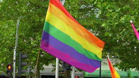 LGBTQ-symbolic-flag-Being-Waved-During-Freedom-March-In-Warsaw,-Poland