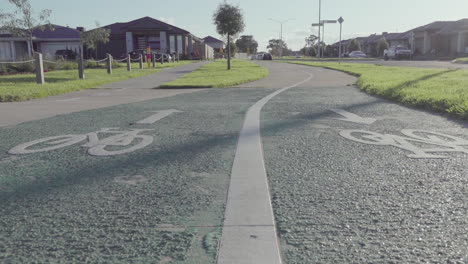 Through-a-dynamic-tracking-shot,-the-camera-reveals-the-intricate-details-of-the-bike-path-while-showcasing-the-peaceful-of-the-neighborhood