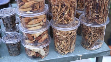 Indian-masala-in-to-plastic-bottles,-close-up-shoot-of-natural-remedy-ingredients