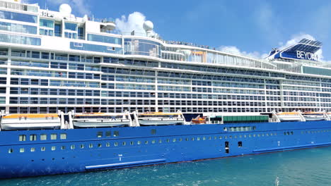 Luxury-cruise-ship-Celebrity-beyond-approaching-island-side-view-video-background-in-4K-|-Celebrity-beyond-cruise-ship-docking-on-port-in-Miami