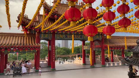 Scene-of-a-group-of-tourists-enjoying-the-peaceful-atmosphere-of-Thean-Hou-Temple-in-Kuala-Lumpur,-Malaysia