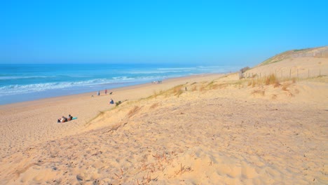 High-angle-shot-from-over-sand-dunes-of-Labenne-Ocean-beach-seen-from-above,-Les-Landes