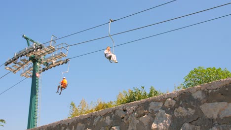 Chairlift-Up-Monte-Solaro-In-Capri,-Italy-At-Daytime---low-angle-shot