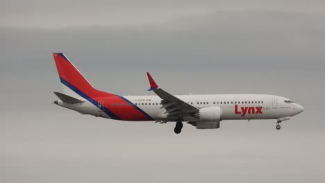 Tracking-follow-of-Lynx-air-airplane-with-landing-gear-wheel-descending-in-sky