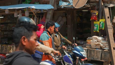 tilt-down-pan-reveals-busy-market-street-corner-in-Kathmandu-Nepal