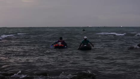 Fish-hunters-using-small-rubber-boats-on-the-coast-of-Rancabuaya,-Garut,-West-Java,-Indonesia