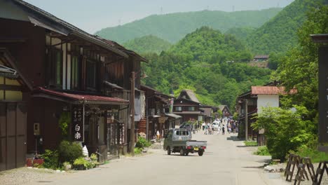 Idyllic-Street-View-In-Shirakawago-with-Forest-Hillside-Landscape-In-Background