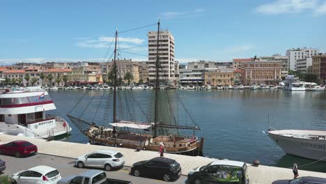 Zadar-harbour-in-summer,-with-docked-tourist-ships-and-city-panorama-in-Croatia