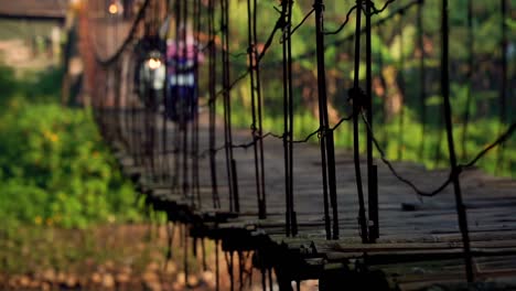 A-traditional-wooden-bridge-spanning-over-big-river