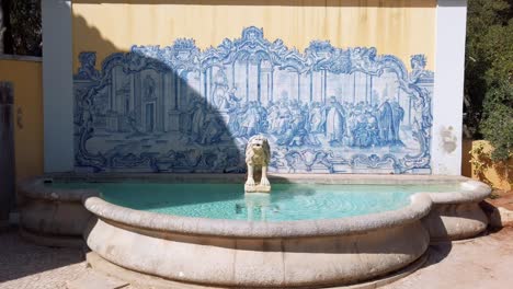 Traditional-tiles-and-painting-with-a-lion-sculpture-next-to-the-entrance-of-Condes-de-Castro-Guimarães-Museum,-Cascais,-Portugal