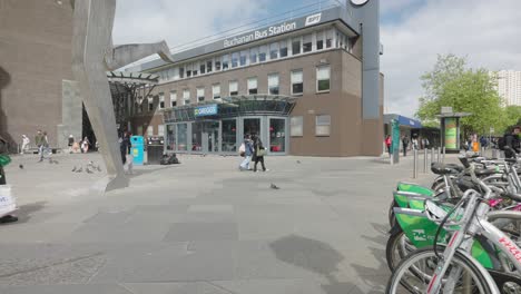 People-walking-past-and-going-into-the-entrance-to-Buchanan-Bus-station