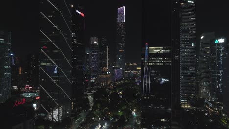 Epic-view-of-fully-illuminated-Guangzhou-downtown-Central-Building-and-Huacheng-Park-and-Canton-Tower-landmark-in-the-distance-at-night