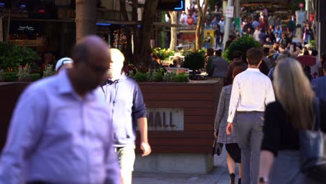 Static-shot-at-downtown-Brisbane-city,-central-business-district,-street-view-capturing-lunch-time-rush-hours-at-bustling-Queen-street-mall-crowded-with-office-workers,-tourists-and-young-students