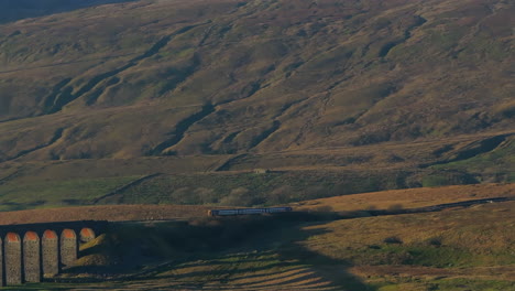 Establishing-Aerial-Drone-Shot-of-Train-in-Yorkshire-Dales-near-Whernside