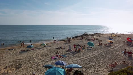 Portugal,-Figueira-da-Foz-pristine-beach-in-autumn-with-full-of-people