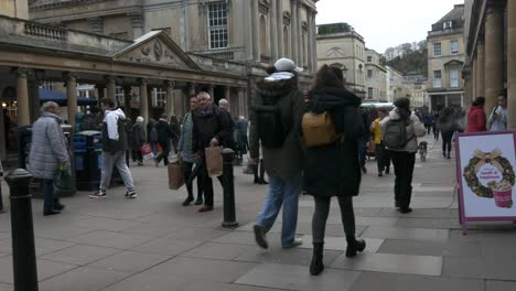People-wonder-down-a-historic-Bath-street-on-a-cloudy-winter-day