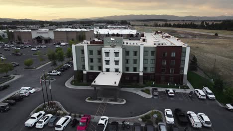 Luxury-Hilton-Hotel-in-Kalispell,-Montana-during-Sunset,-Aerial-Orbit