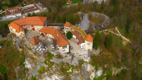 Drone-right-side-rotating-view-of-lake-Bled-island-and-castle-reveal