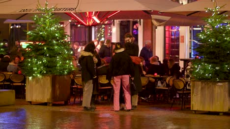 People-in-the-Entertainment-Area-of-Groningen-near-the-Grote-Markt,-Man-Hugging-a-Woman