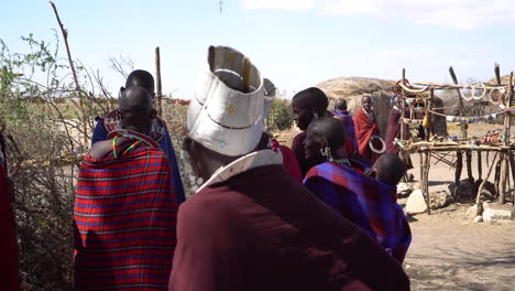 Females-From-Primitive-Maasai-Tribe-in-Colorful-Traditional-Dresses,-Ethnic-Group-Living-in-African-Savannah