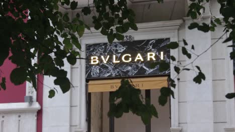 Luxury-Fashion-Storefront-in-Portugal-With-Tree-Leaves-in-Foreground