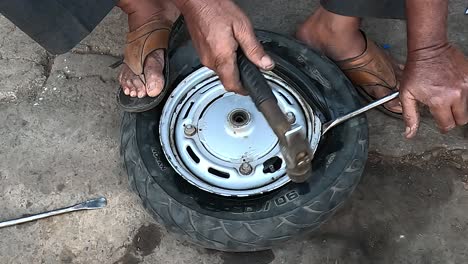 pov-shot-close-up-seen-equalizing-the-tube-puncture-by-hammering