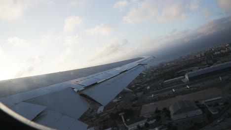 Airplane-taking-off-in-the-morning-at-Lisbon-airport-in-Portugal-sky-with-clouds