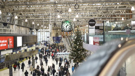 Wide-shot-of-Waterloo-Station-London-train-station-at-holiday-time-ascending-escalator-point-of-view