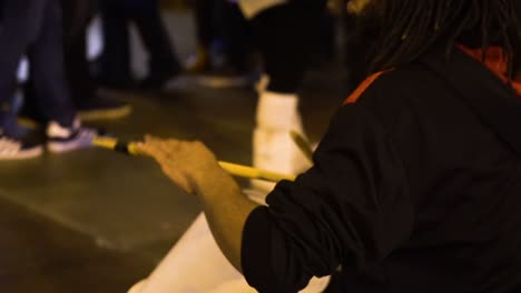 The-black-street-drummer-plays-drums-on-the-street-in-Chicago,-Illinois