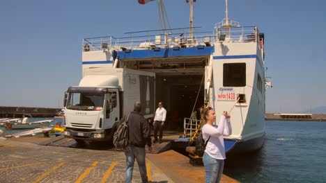 Ferry-Boat-With-A-Truck-Getting-Off-The-Ship-In-The-Island-Of-Capri,-Italy