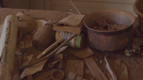 Old-and-rusted-miscellaneous-kitchen-items-in-a-deserted-house