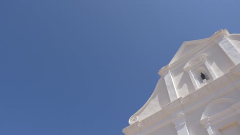 San-Giacomo-Church,-turning-shot-of-the-white-facade