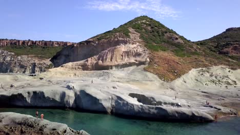 Drone-Aerial-shot-of-the-natural-swimming-pool-of-Cane-Malu-in-Sardinia,-Italy