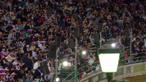 Massive-crowds-gathered-at-the-main-arena-at-Showgrounds-for-iconic-Ekkanites,-legendary-trots-competing-on-the-track,-live-performance-and-fireworks-at-Ekka-Brisbane-Royal-Queensland-Show