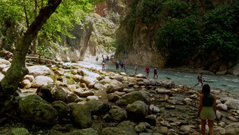 Tourists-explore-Saklikent-gorge-rocky-canyon-with-dangerous-rapid-waters