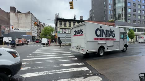 POV-Walking-Up-To-Crossing-With-Van-Going-Past-In-New-York-On-Overcast-Day