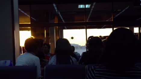 Airplane-passengers-waiting-in-lobby-hall-at-sunset