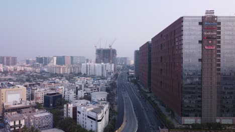 Cinematic-drone-shot-of-HITECH-City-Technology-Park-with-modern-skyline-Financial-and-residential-buildings,-Hyderabad