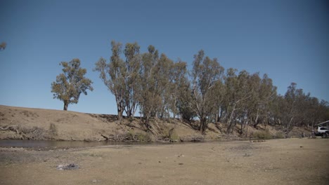 Yellow-car-with-caravan-camping-at-Ponto-Falls-Reserve