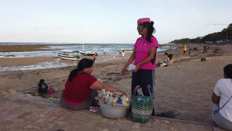 Street-Sellers-Work-At-The-Beach-in-Sanur-Bali-Indonesia,-Balinese-Local-People-Traditional-Market