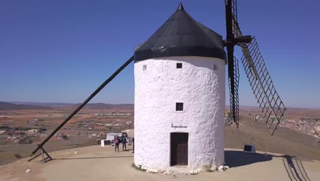 Drone-Shote,-Flying-over-a-white-old-windmill